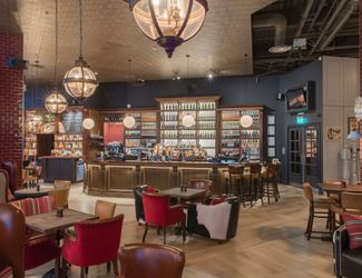 Main bar area at the bull with the wood panelled bar at the back