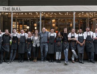 The team of the bull stood outside the pub