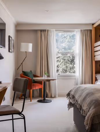 The Park Hotel room with a bunk bed and a king-size bed