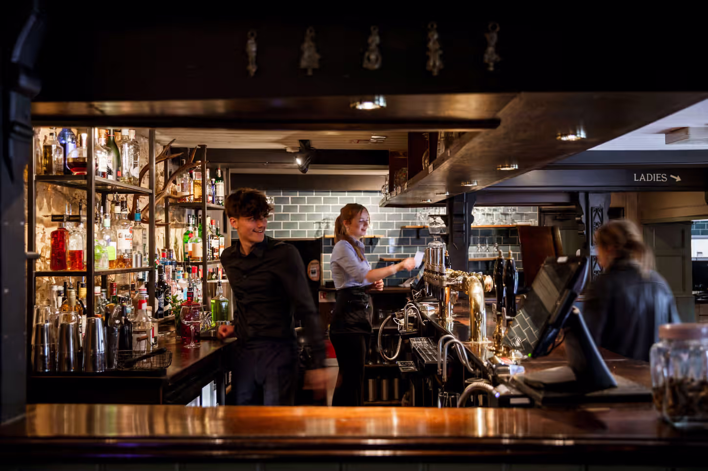 Young's bartenders preparing drinks