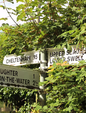 road sign pointing to Upper and Lower Slaughter, Cheltenham, Lower Swell and Bourton-on-the-Water