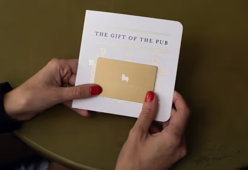 person holding a Young's gift card