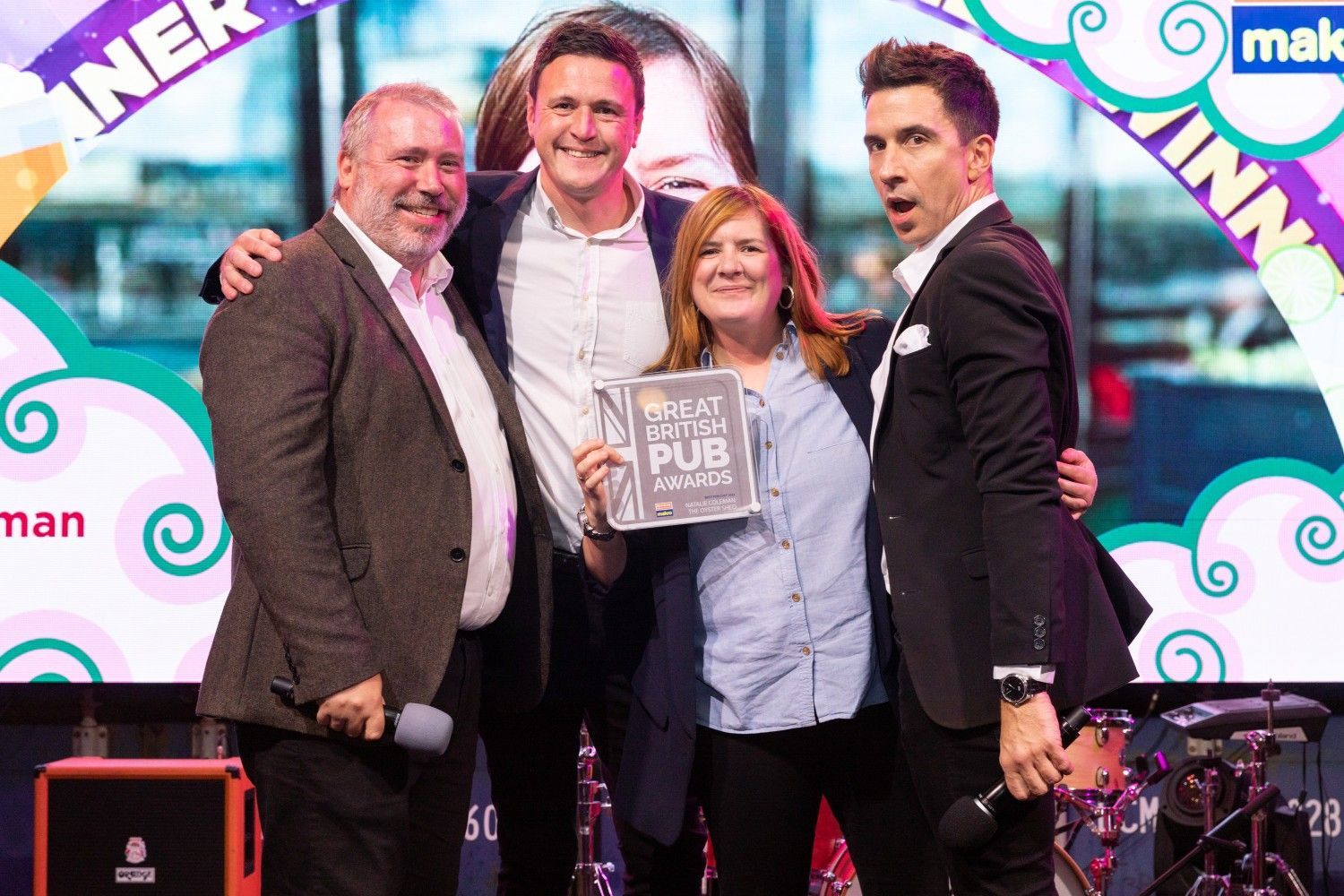 Natalie Coleman holding the Pub Chef of the Year award at the Great British Pub Awards