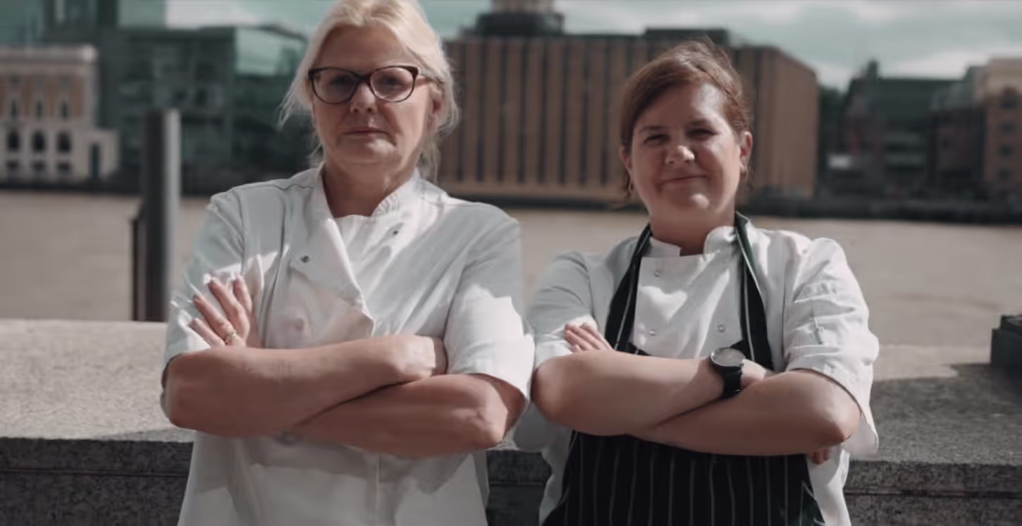 Natalie Coleman and another chef standing side by side with their arms crossed