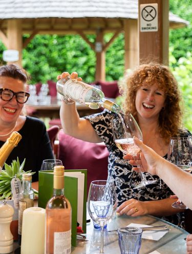 Drinks flowing in a garden hut at the Carpenter's Arms, Tonbridge Kent